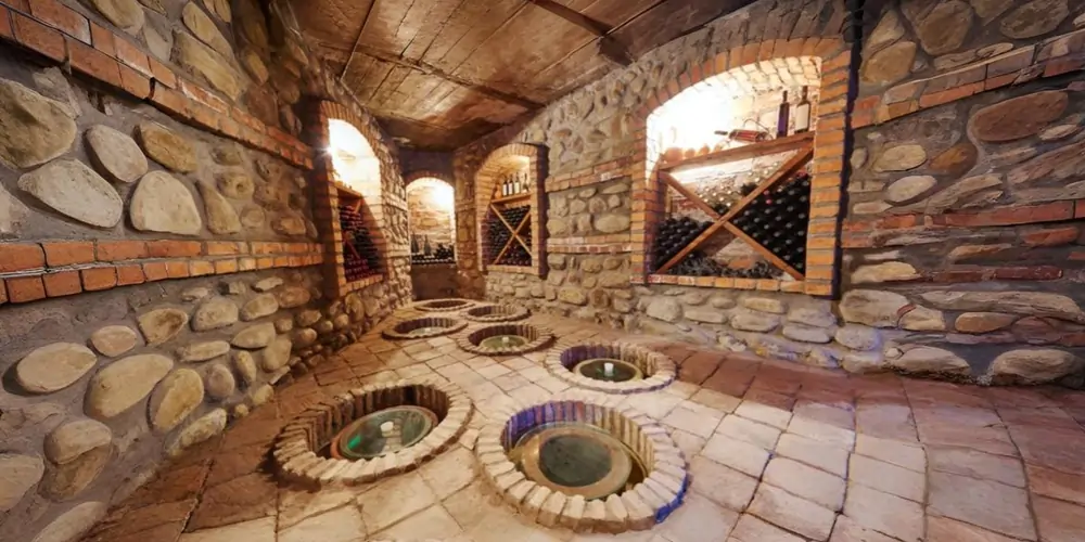 georgia-wine cellar-with-qvevri-in-floor A traditional stone Georgian wine cellar with qvevri embedded in the floor, showcasing ancient winemaking practices linked to the origin of wine