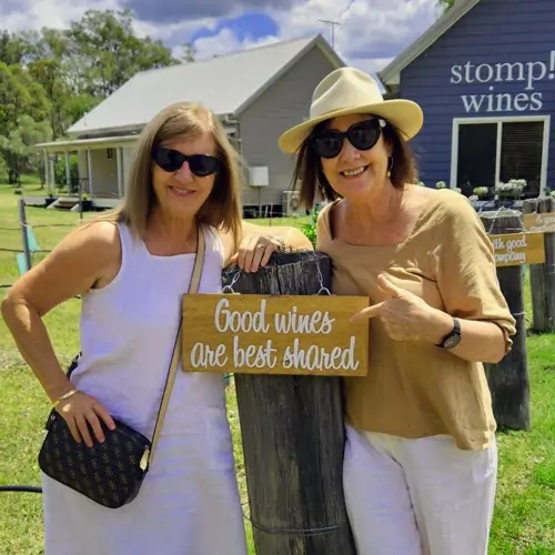 friends-on-a-wine-tour Two friends enjoying a Hunter Valley wine tour at Stomp Wines, on a warm afternoon